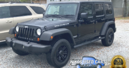Jeep Wrangler Unlimited Rubicon, Black Clearcoat/Black Soft Top, 2009